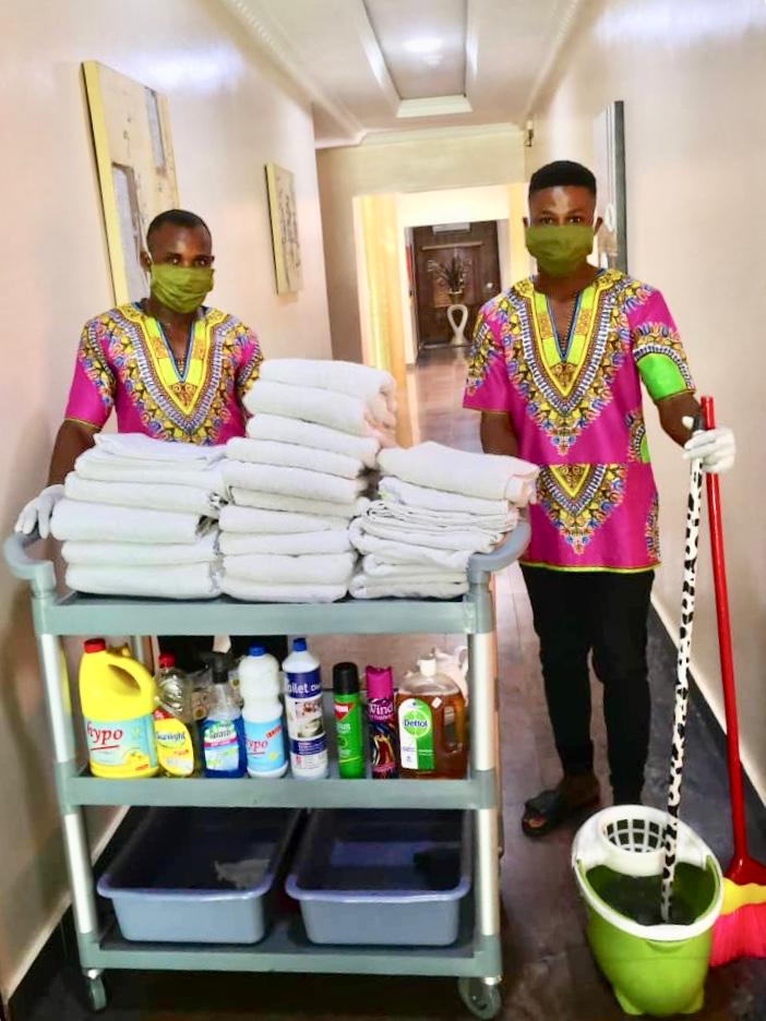staff with cleaning equipment